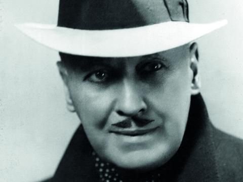 A black and white image of founder of the Alhambra Theatre Francis Laidler wearing a formal coat and white hat.